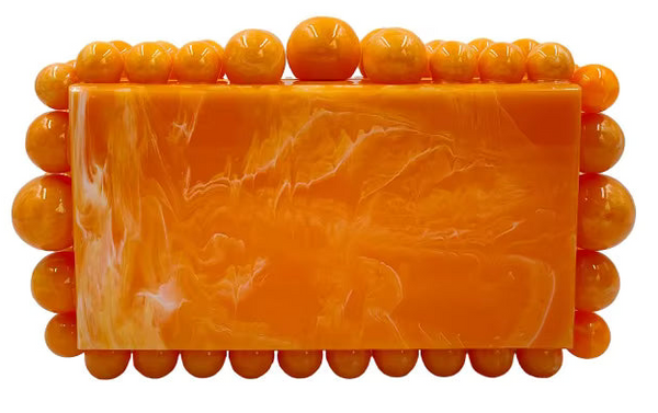 Rectangular bar of soap with a textured surface, encased in a decorative border of orange beads on a white background.