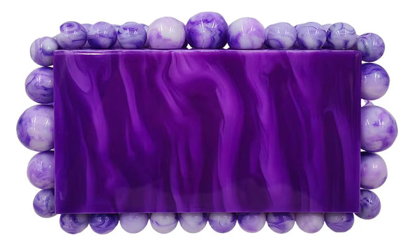 Purple beaded clutch bag with a white background