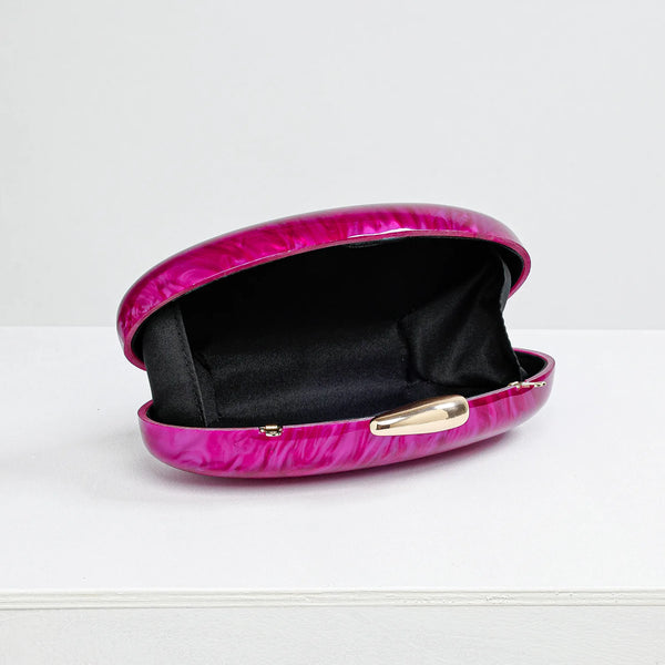 Pink clutch bag with gold clasp on a white background