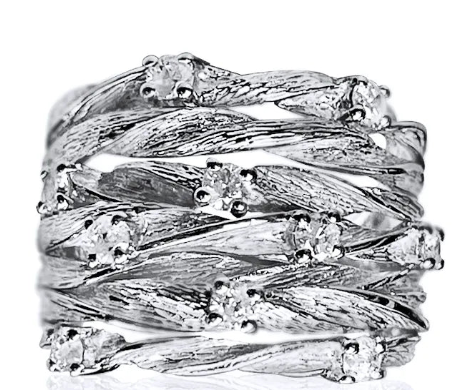 This Stack Spiral Silver Ring is a high, twisted ring sprinkled with tiny cubic zircons. Make a statement with the Stack Spiral Silver Ring, finished in shining silver. 