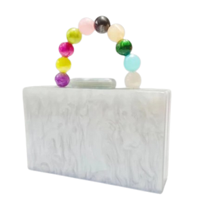 White rectangle hard clutch bag with colorful bead handle on a white background