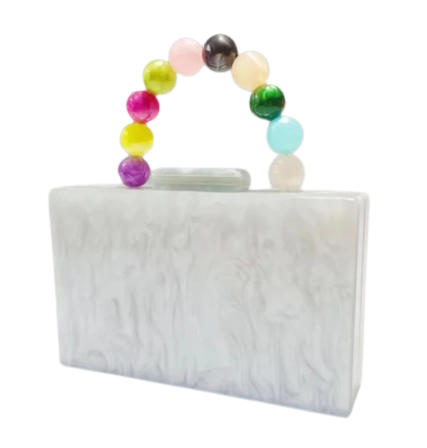 White rectangle hard clutch bag with colorful bead handle on a white background