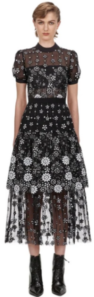 Zeze Lace Cocktail Dress is a sheer mesh black midi cocktail dress. Short puff sleeve with white flower embroidery detail. A-line with stand, round neck with generous layers of lace and large frills.