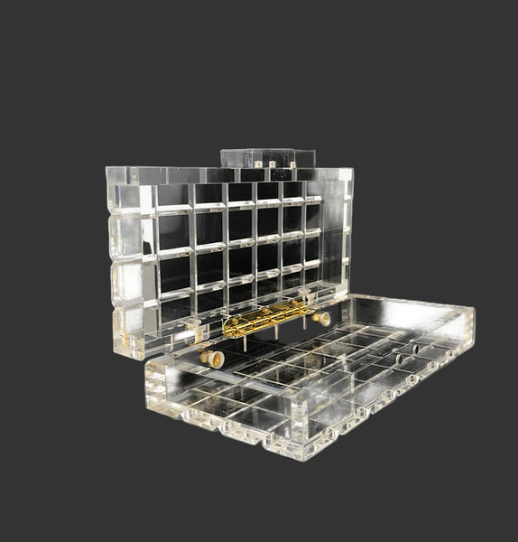 Crystal clear rectangle, plaid luxury acrylic box evening purse. Comes with various removeable different length chains.  There is something beautiful about this transparent glass-like clutch.