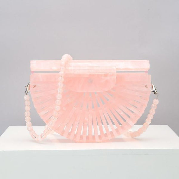This Half Moon Bag is a half circle, acrylic basket design. This clutch bag is beautifully crafted, easy to clean and looks gorgeous. Removeable beaded or black cross over straps.