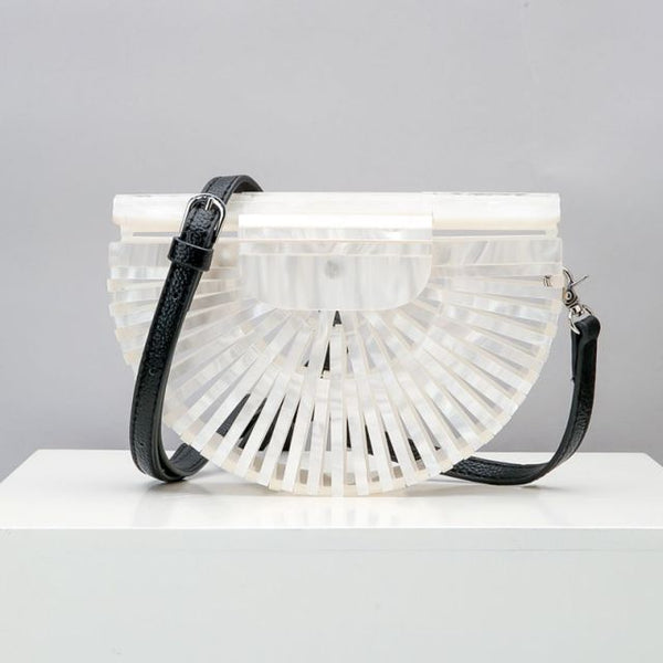 This Half Moon Bag is a half circle, acrylic basket design. This clutch bag is beautifully crafted, easy to clean and looks gorgeous. Removeable beaded or black cross over straps.