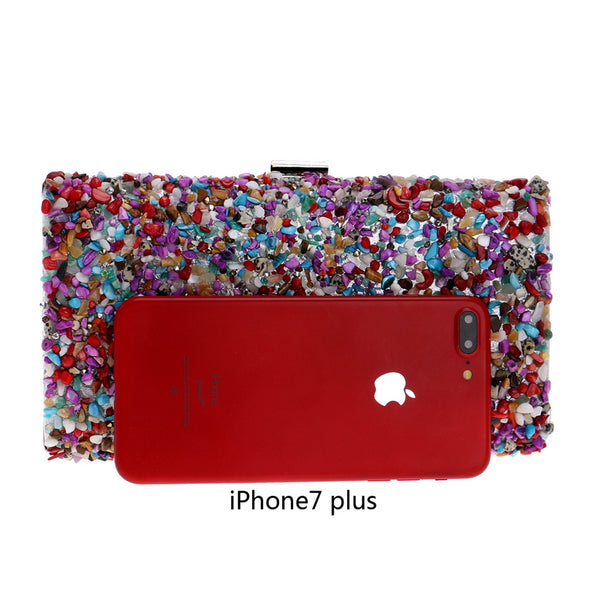 Colourfully tactile, the Ocean Candy Clutch Purse is sprinkled and coated with colored tiny acrylic crystals, stones, gemstones, beads and shells. With crossbody silver chain. 