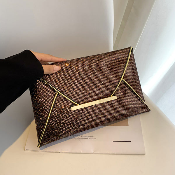 The Snake Pattern Envelope Clutch Sis a flat, lined envelope clutch bag with colored alligator snake pattern. Magnetic metal tab closure. In 100 Percent PU eco leather.