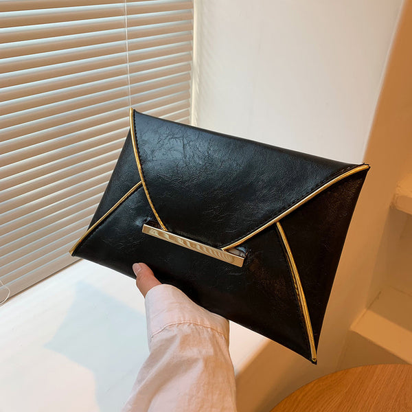 The Snake Pattern Envelope Clutch Sis a flat, lined envelope clutch bag with colored alligator snake pattern. Magnetic metal tab closure. In 100 Percent PU eco leather.