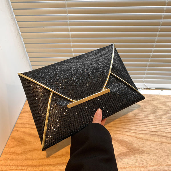 The Snake Pattern Envelope Clutch Sis a flat, lined envelope clutch bag with colored alligator snake pattern. Magnetic metal tab closure. In 100 Percent PU eco leather.