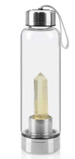 Crystal Quartz Water Bottle is made of glass, stainless steel  and quartz crystals. The bottle has a handy carry strap to carry to the gym and yoga. Eco-friendly, Led & PBA Free.