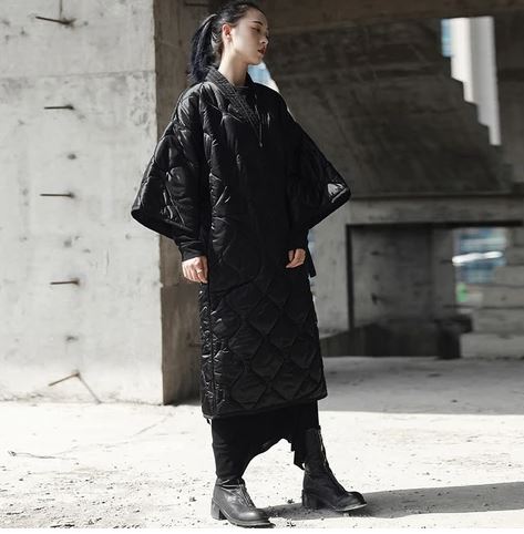 Kose is a beautiful quilted wrap jacket, with winged sleeves, and sash belt. 