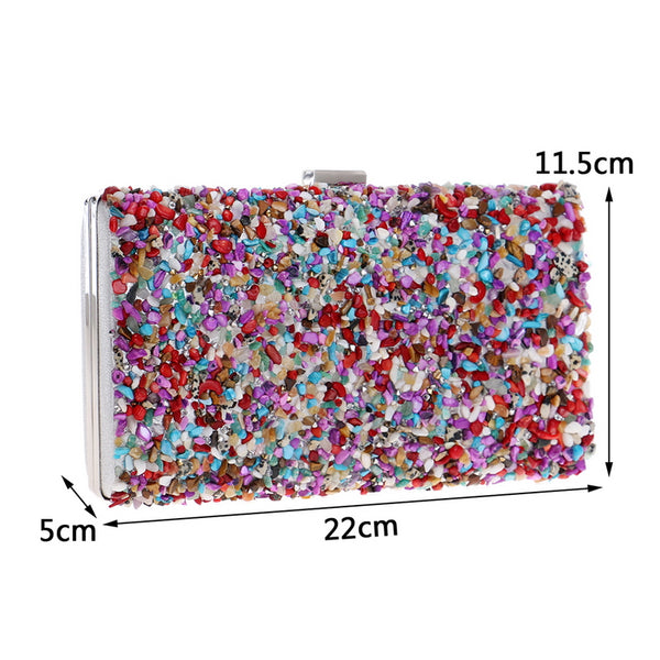 Colourfully tactile, the Ocean Candy Clutch Purse is sprinkled and coated with colored tiny acrylic crystals, stones, gemstones, beads and shells. With crossbody silver chain. 