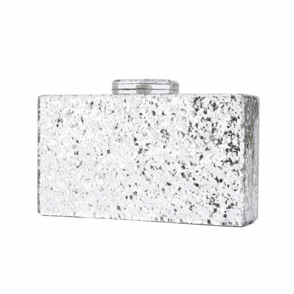 This striking clutch is crafted from shimmering glitter gold fabric.  Bring stunning, Glitter Gold Clutch for evening, cocktail, party. Also, available in Silver Glitter Clutch. This rectangle minaudiere, has metallic foil coated surround. 