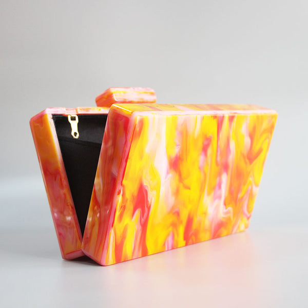 Marble Hot Orange Clutch acrylic box will fit your cards, make up + mobile phone.  Rectangular in shape. Cotton lining and various chain straps for cross body wear.
