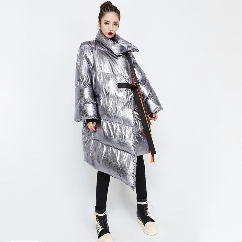 This high-performance Metallic Silver Puffer Asymmetric Jacket is designed with waterproof and windproof properties.