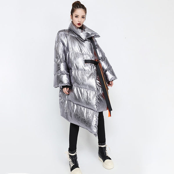 This high-performance Metallic Silver Puffer Asymmetric Jacket is designed with waterproof and windproof properties.