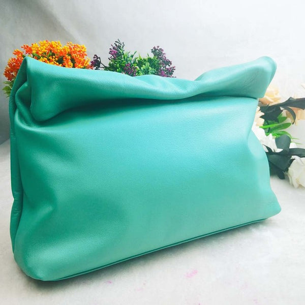 Stunning soft genuine leather folded envelope day clutch bag. A range of gorgeous colours including apple green, lilac, turquoise beige, tan and silver grey.  Shape - Baguette, Envelope Fold Handbags Type - Day Clutches Main Material - Genuine Leather Size - 32 x 28 cm Hardness - Soft Interior - 100% Lined, with Cell Phone Pocket Closure -  Button