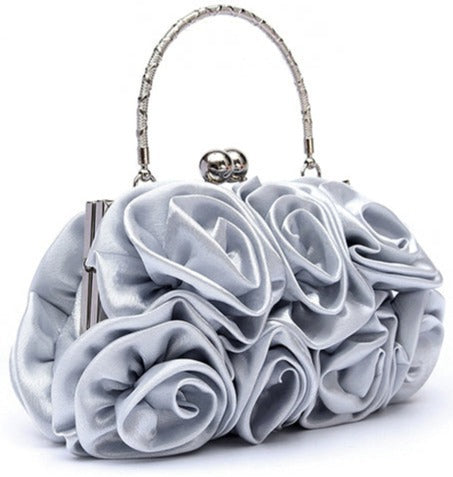 This Rose Tote Bag Metal Handle offers a luxurious way to carry essentials. The metal handle provides an elegant and strong grip. In silver, champagne, white black and red.