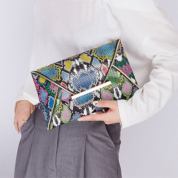 Snake Pattern Envelope Clutch - Source.AtSlimline, lined envelope clutch bag with colored alligator snake pattern. Thin metal tab closure. For everyday occasions, night life, parties and celebrations. Looks sharp, sleak and modern.
