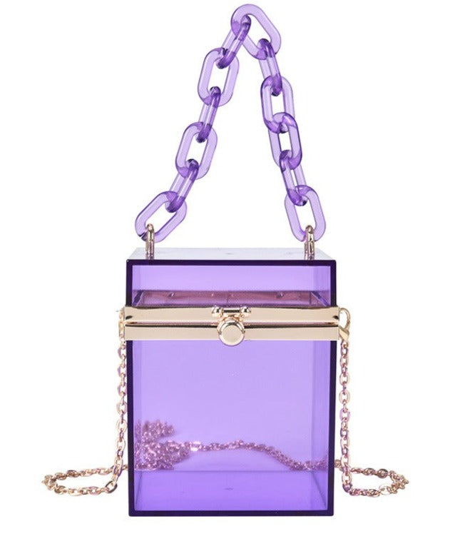This Square Colored Acrylic Box Bag is very cool. It's a transparent acrylic square box tiny bag. In gorgeous colored acrylics. Also comes with hand chain and crossbody silver chain.