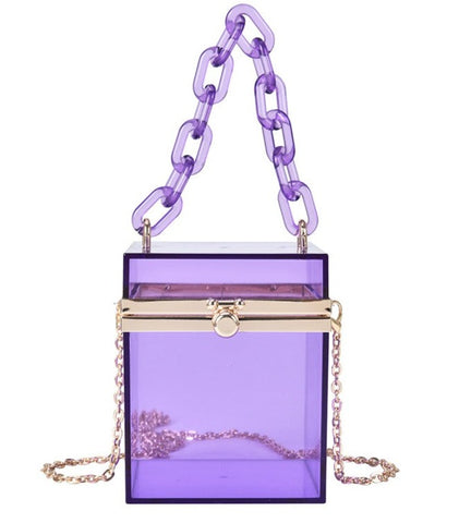 Transparent acrylic box tiny bag. In gorgeous colored acrylic. With acrylic hand chain & crossbody silver chain  Types of bags - Tiny hand & crossbody Closure Type - Clasp Size - 10 x 10 x 13 cm