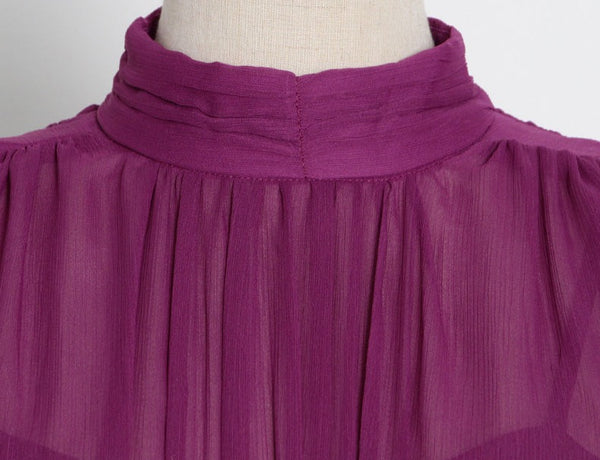 Ruched stand collar sleeveless high, empire waist chiffon dress. Long slim keyhole in back for summer. Soft and Flowing, midi length Black, Purple, White and Red.