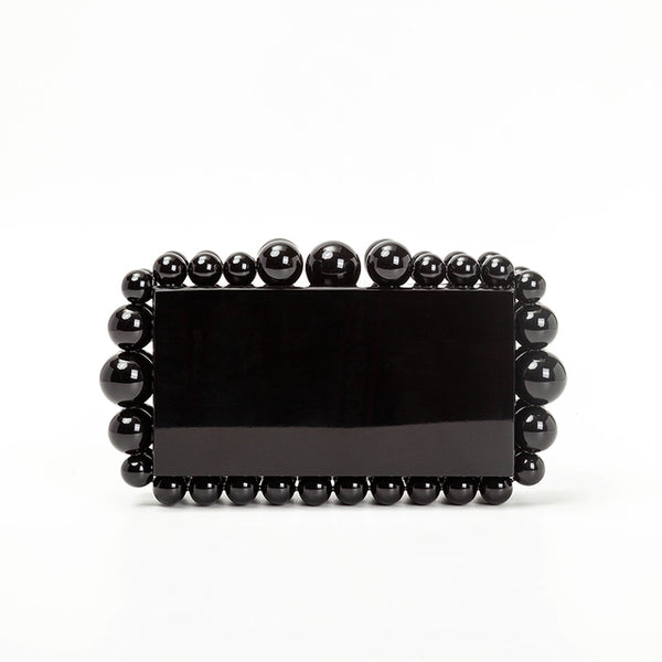 This Round Bead Acrylic Box Clutch is the perfect accessory for any night out. The clutch has a sleek box silhouette perfect for adding a classic touch to your look.