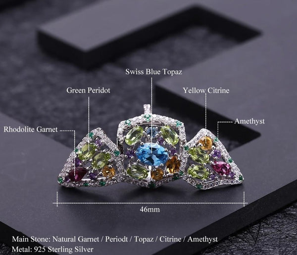 Cosmos Gem Ring is a complex ring with Swiss Blue Topaz the main astone, attached by silver lattice, to Green Peridot, Rhodolite Garnet, Yellow Citrine and Amethyst.
